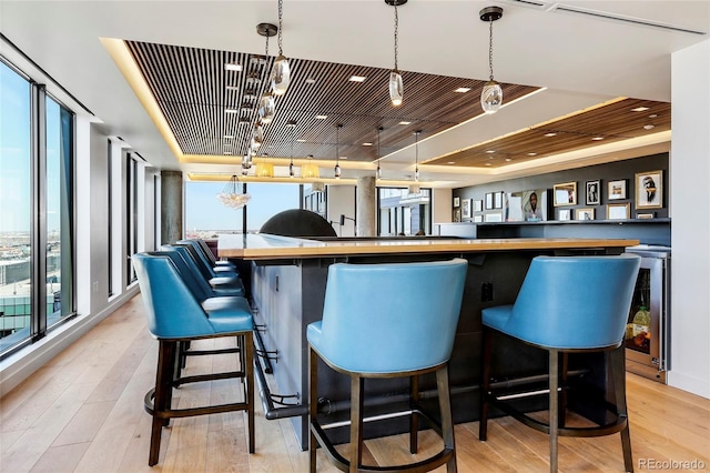 1750 Wewatta St Unit 525, Denver, CO 80202 - bar area with a raised ceiling and plenty of natural light