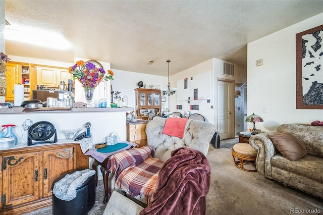 living area featuring light carpet, visible vents, and a textured ceiling