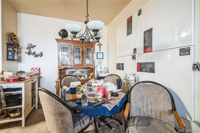 dining space featuring light carpet and an inviting chandelier