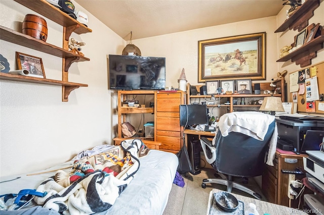 bedroom with carpet floors and vaulted ceiling