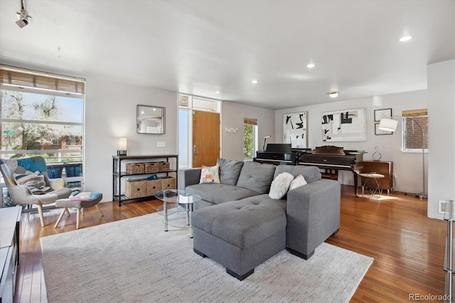 190 W Archer Pl, Denver, CO 80223 - living room featuring plenty of natural light, recessed lighting, and wood finished floors