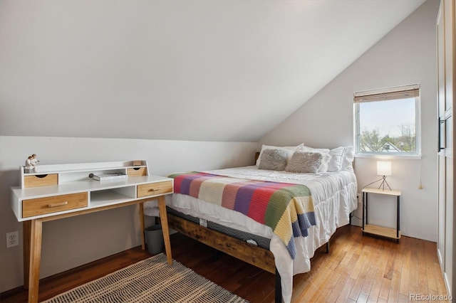 190 W Archer Pl, Denver, CO 80223 - bedroom with wood-type flooring and lofted ceiling