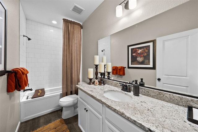4475 Hidden Gulch Rd, Castle Rock, CO 80104 - full bathroom featuring wood finished floors, toilet, vanity, and shower / bath combo with shower curtain