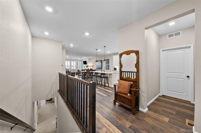 4475 Hidden Gulch Rd, Castle Rock, CO 80104 - hallway featuring dark wood finished floors, recessed lighting, and baseboards