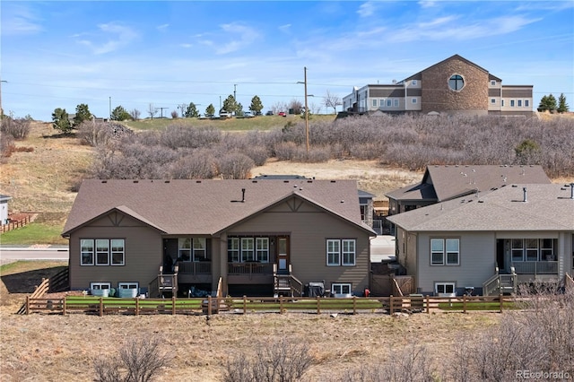 4475 Hidden Gulch Rd, Castle Rock, CO 80104 - back of house with fence and roof with shingles