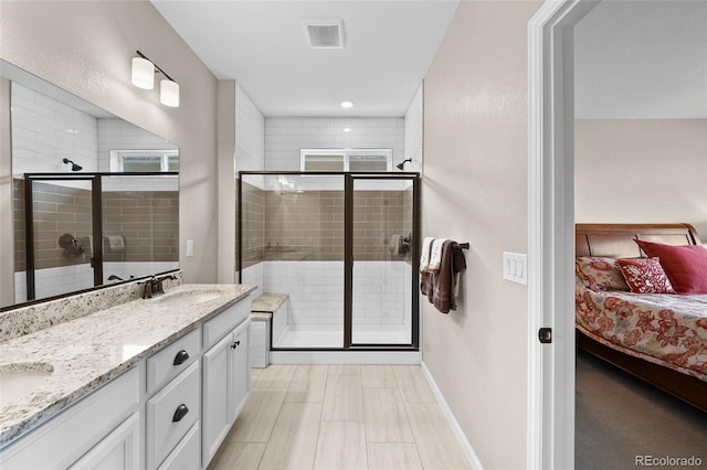 4475 Hidden Gulch Rd, Castle Rock, CO 80104 - ensuite bathroom with a stall shower, baseboards, and double vanity