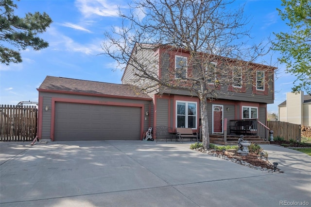11321 N Brownstone Dr, Parker, CO 80138 - view of front of home with fence, concrete driveway, and a garage