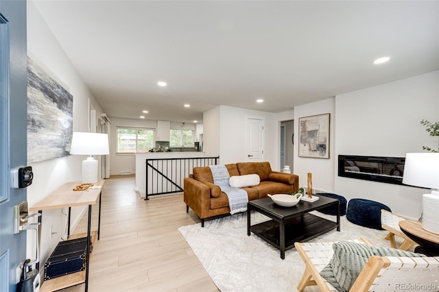 5780 W 5th Ave, Lakewood, CO 80226 - living room with light wood finished floors and recessed lighting