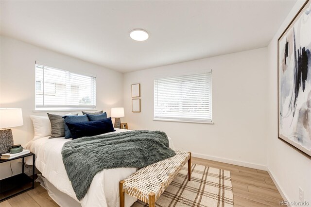 5780 W 5th Ave, Lakewood, CO 80226 - bedroom with light wood-style floors