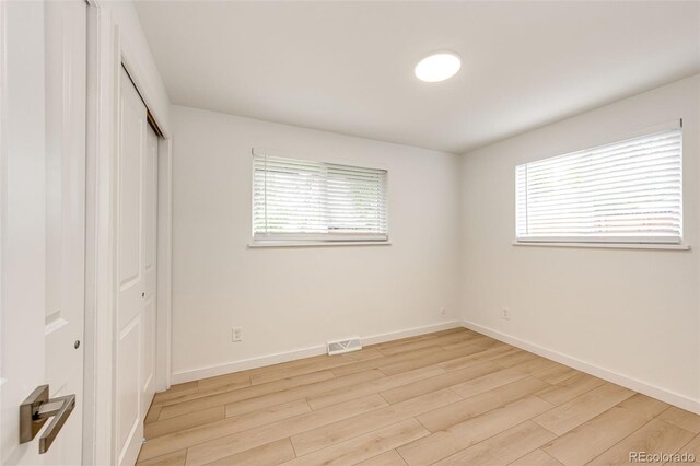 5780 W 5th Ave, Lakewood, CO 80226 - unfurnished bedroom with light wood-type flooring and a closet