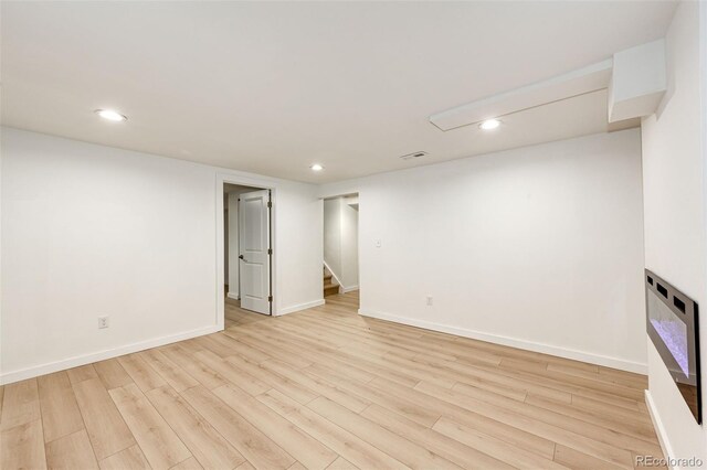 5780 W 5th Ave, Lakewood, CO 80226 - finished below grade area featuring recessed lighting, light wood finished floors, stairs, and heating unit