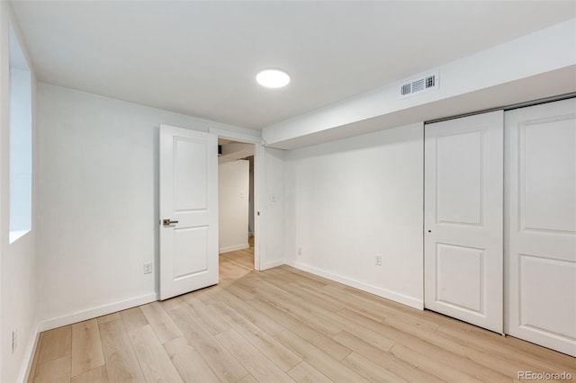 5780 W 5th Ave, Lakewood, CO 80226 - unfurnished bedroom featuring light wood-style floors and a closet