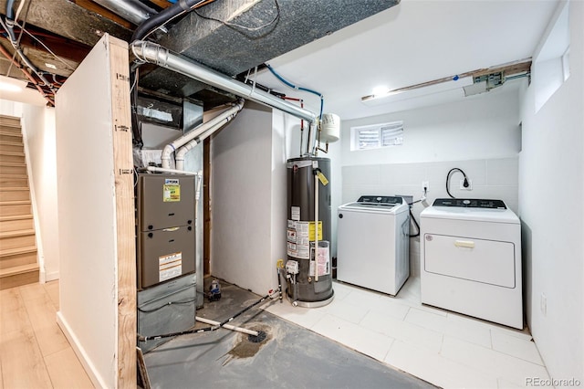 5780 W 5th Ave, Lakewood, CO 80226 - basement featuring washer and dryer, water heater, and stairs