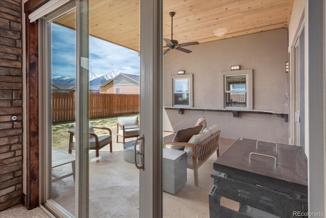 doorway to outside featuring ceiling fan