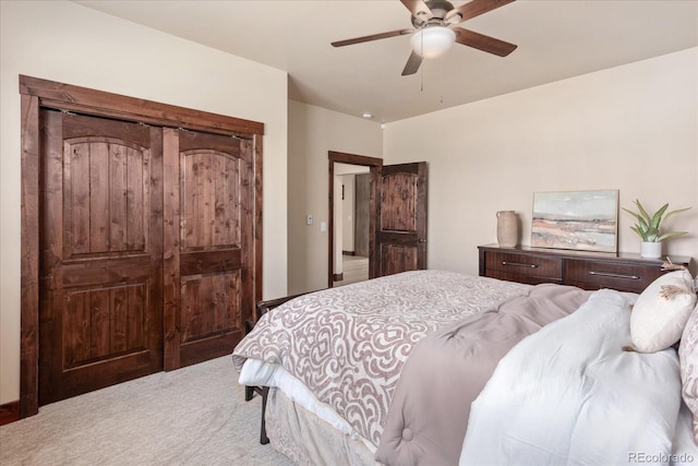 carpeted bedroom with a ceiling fan