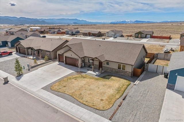 bird's eye view featuring a mountain view and a residential view