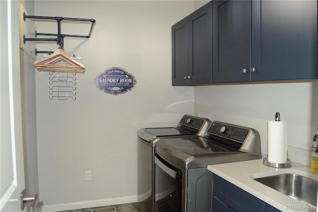 9028 S Catawba St, Aurora, CO 80016 - washroom with cabinet space, washing machine and clothes dryer, and baseboards