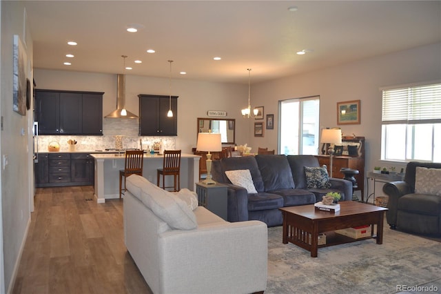 9028 S Catawba St, Aurora, CO 80016 - living area with a chandelier, dark wood-style flooring, and recessed lighting