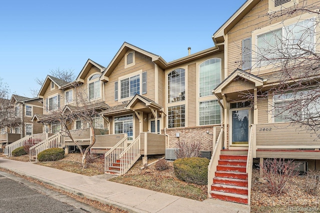 townhome / multi-family property featuring central AC unit