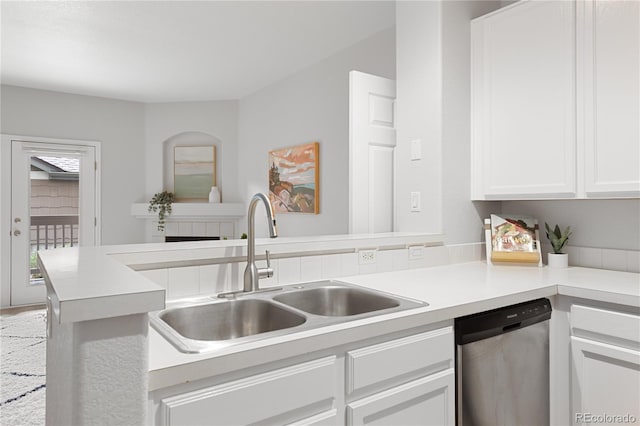 4385 S Balsam St Unit 5-104, Littleton, CO 80123 - kitchen featuring stainless steel dishwasher, white cabinetry, light countertops, and a peninsula