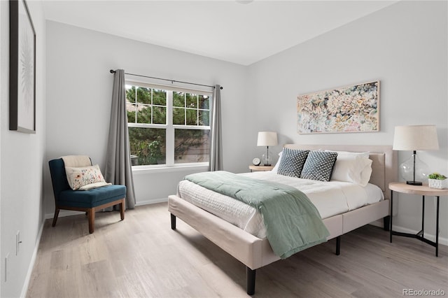 4385 S Balsam St Unit 5-104, Littleton, CO 80123 - bedroom featuring light wood finished floors and baseboards