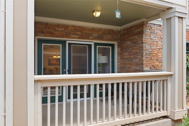 4385 S Balsam St Unit 5-104, Littleton, CO 80123 - view of side of property with brick siding and a porch