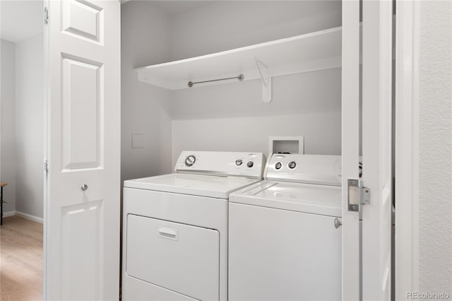 4385 S Balsam St Unit 5-104, Littleton, CO 80123 - laundry area with washer and dryer and light wood-style floors