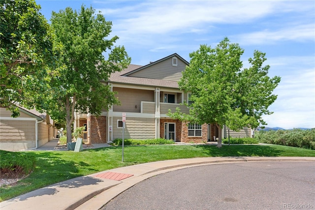 4385 S Balsam St Unit 5-104, Littleton, CO 80123 - obstructed view of property featuring a front yard