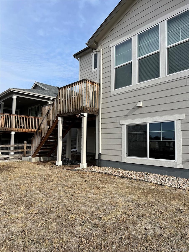 back of property featuring a wooden deck