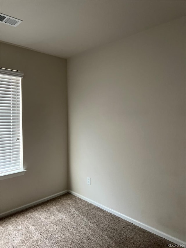 empty room with carpet flooring