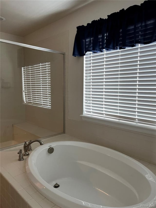 bathroom with tiled bath