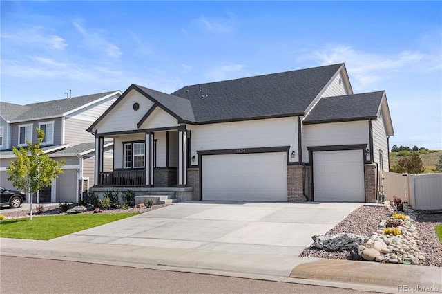 view of front of property with a porch and a garage