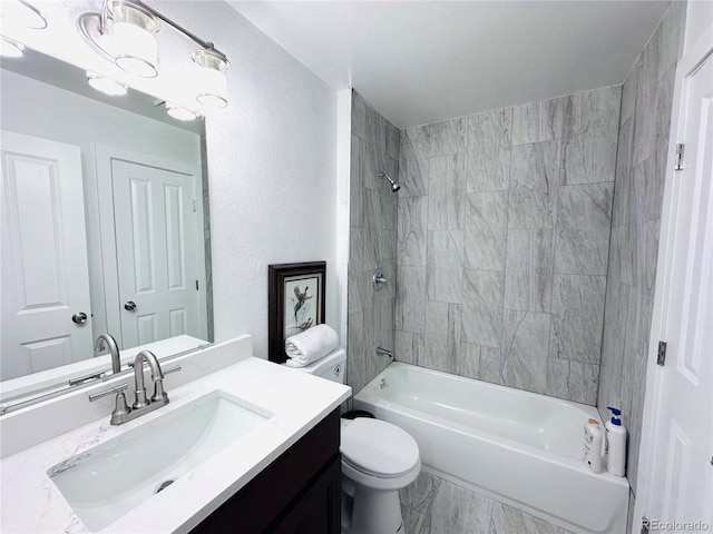 full bath featuring vanity,  shower combination, toilet, and marble finish floor