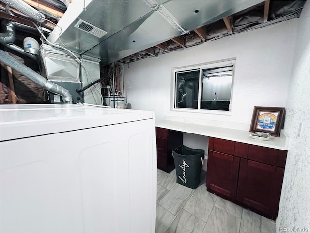 clothes washing area with visible vents, washer / dryer, laundry area, and marble finish floor