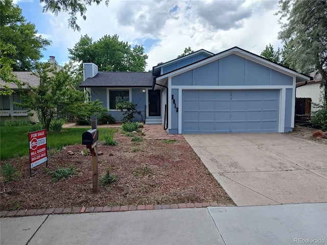 3613 S Olathe St, Aurora, CO 80013 - single story home featuring an attached garage, driveway, and a chimney