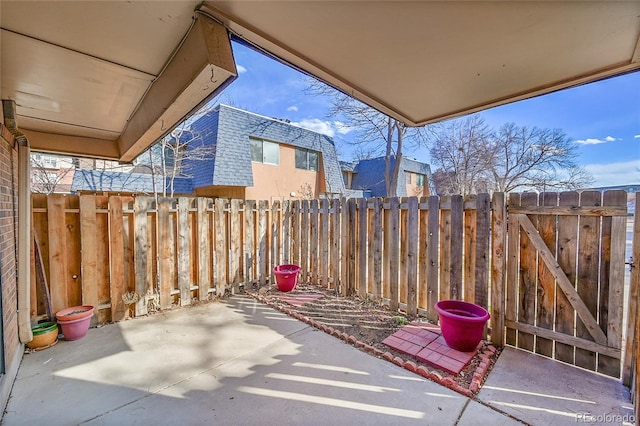 view of patio / terrace featuring a gate and fence