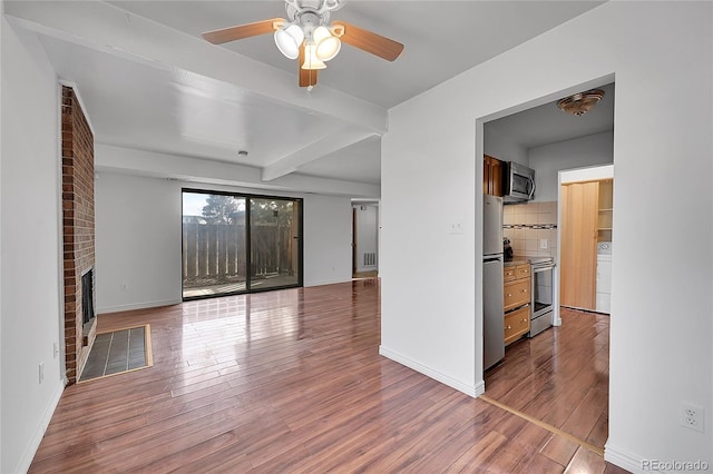 unfurnished living room with baseboards, a fireplace, hardwood / wood-style floors, and a ceiling fan