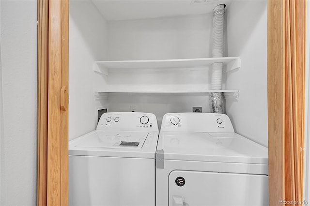 laundry room featuring washer and dryer and laundry area