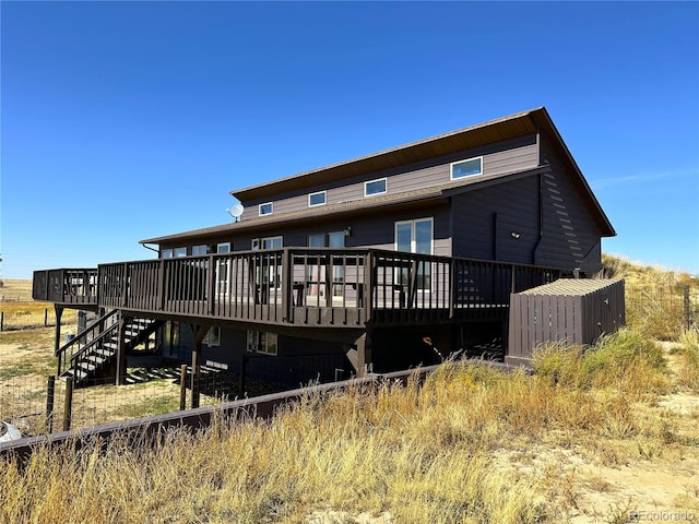 rear view of property with a wooden deck