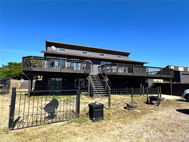 back of property featuring a deck