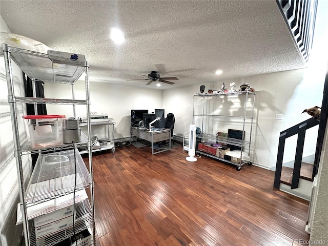 home office featuring ceiling fan, hardwood / wood-style floors, and a textured ceiling