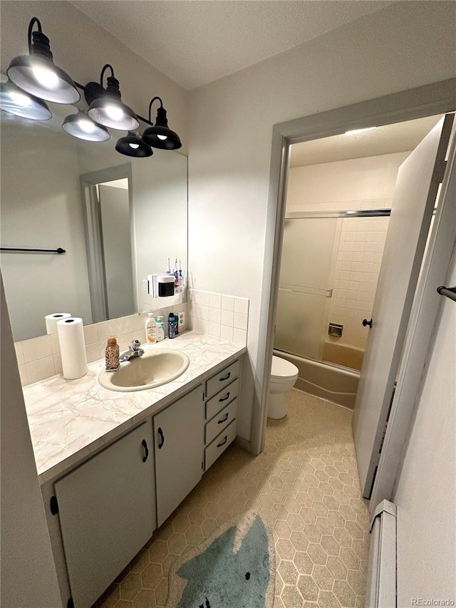 full bathroom featuring tile patterned floors, tub / shower combination, vanity, a baseboard heating unit, and toilet