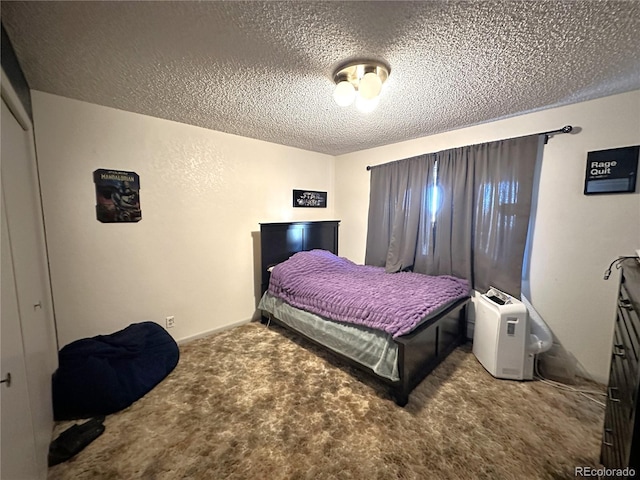 carpeted bedroom featuring a closet and a textured ceiling