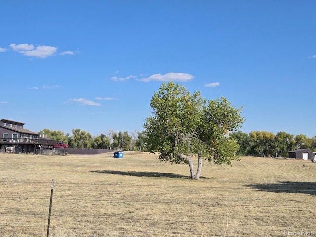 view of yard with a rural view