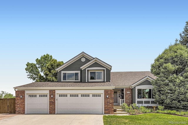 9229 Sugarstone Cir, Highlands Ranch, CO 80130 - view of front of house with driveway, brick siding, a shingled roof, and a garage