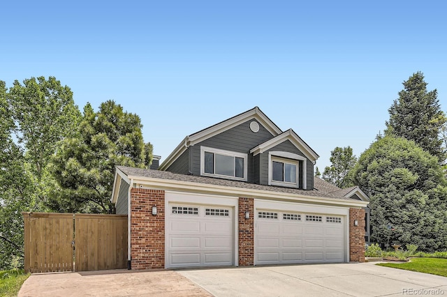 9229 Sugarstone Cir, Highlands Ranch, CO 80130 - view of front facade with brick siding and driveway