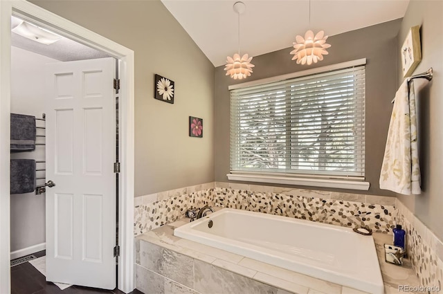 9229 Sugarstone Cir, Highlands Ranch, CO 80130 - full bath featuring a garden tub and vaulted ceiling
