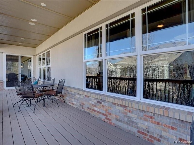 wooden deck with outdoor dining area