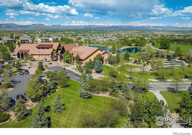 bird's eye view featuring a residential view and a water and mountain view