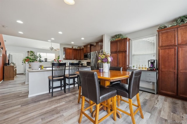 dining area featuring light wood-type flooring and recessed lighting